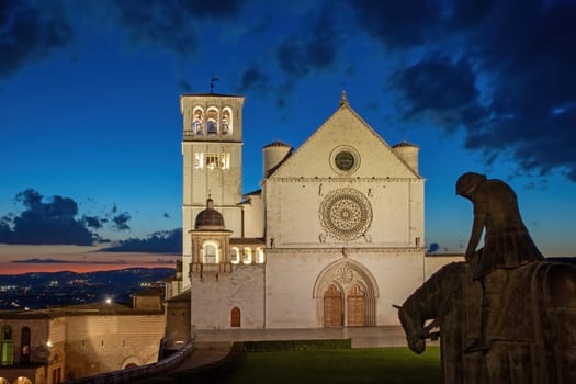 Night photo of the Basilica of St. Francis (Basilica di San Francesco) in Assisi. Umbia. Italy.  Horizontally.