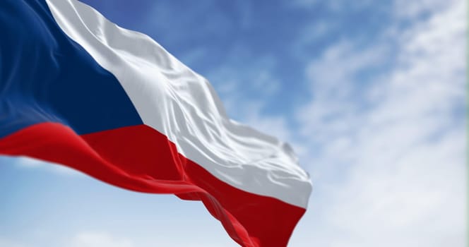 National flag of Czech Republic waving in the wind on a clear day. Two equal horizontal bands of white and red with a blue isosceles triangle on the hoist side. 3d illustration render. Rippled fabric