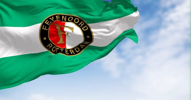 Rotterdam NED, sept. 20 2023: Close-up view of the Feyenoord Rotterdam flag waving in the wind. Feyenoord is a Dutch football club based in Rotterdam. Illustrative editorial 3d illustration render