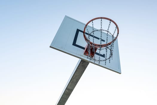 Basketball hoop in the white sky view