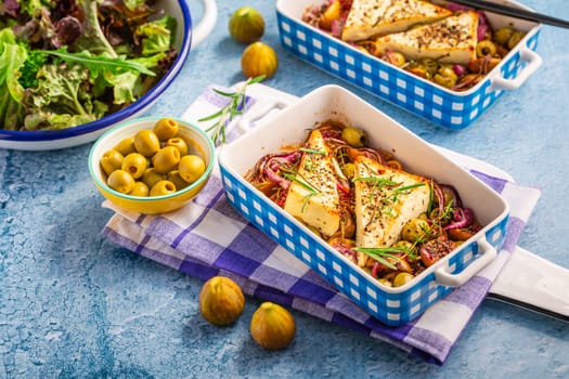 Baked sheep cheese, feta cheese with olives, figs, onions and green salad (Bouyiourdi)