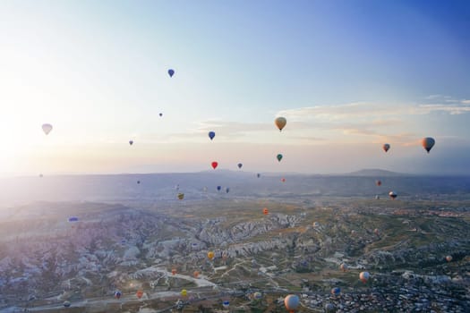 Beautiful morning scene with Hot air balloons flying over Love valley at sunrise, Tourist attraction of Cappadocia, Goreme, Nevsehir, Turkey