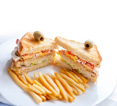 Closeup of club sandwiches with chickan, egg, salad, toast bread and french fries served on white plate. Healthy breakfast snack restaurant isolated on white background.