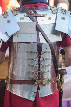 Reenactor dressed in lorica segmentata. Back view
