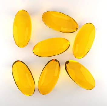 Golden oil capsule of vitamin A, E, Omega 3 or collagen. of medical pill with fish fat or organic cosmetic oil on white background