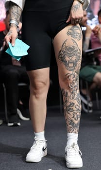 Krakow, Poland - June 11, 2022: Unidentified participant during the contest for the best tattoo at the 15th Tattoofest Convention in Cracow. One of the most prestigious tattoo festivals.