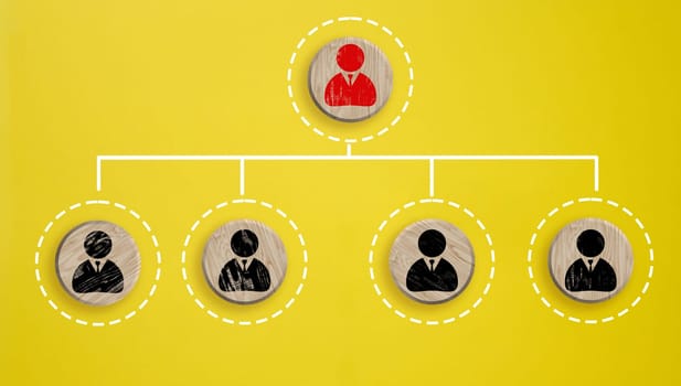 Wooden round block with staff icon which link connection network for organisation structure social network and teamwork concept, top view