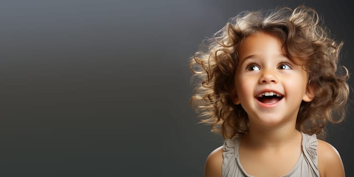 Portrait of a happy toddler girl, smiling child face, white shirt, baby and childhood concept, positive emotion