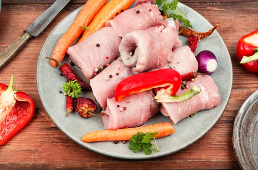 Fresh, delicious uncooked pork meat rolls and vegetable. Raw meat.