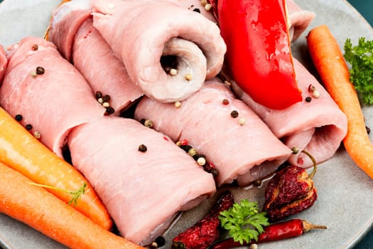 Fresh, delicious uncooked pork meat rolls and vegetable. Raw meat.