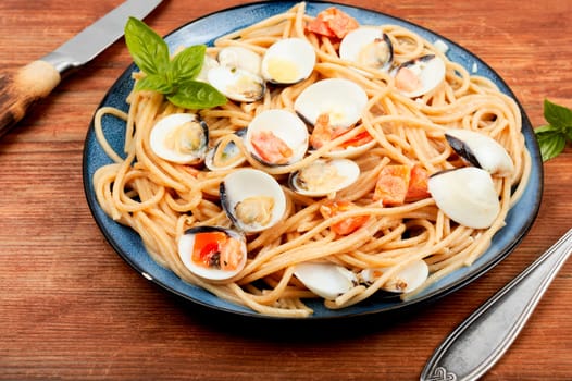 Linguini with clams, seafood pasta with clams and spaghetti. Space for text