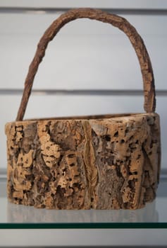 Vila Nova, Portugal - Jul 26th, 2023: Basket made of cork. Alentejo crafts displayed at tourist office, Vila Nova de Milfontes, Portugal
