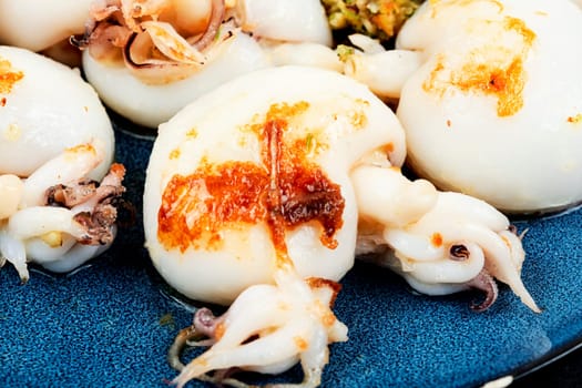 Fried squid or calamari served with nut salad. Roasted whole calamari.
