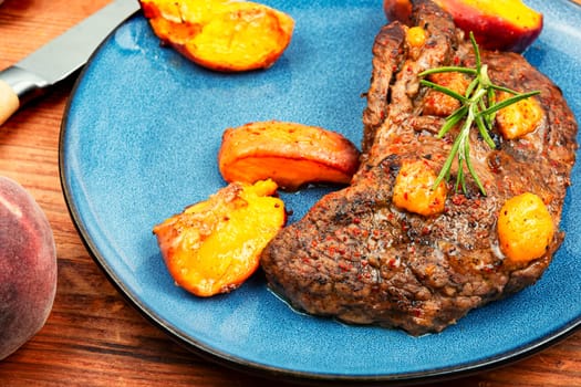 Diet baked beef steak with peach. Space for text