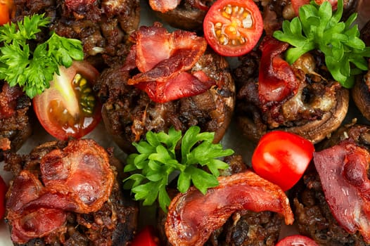 Appetizing champignon mushrooms stuffed with turkey, ground turkey,and bacon. Close up