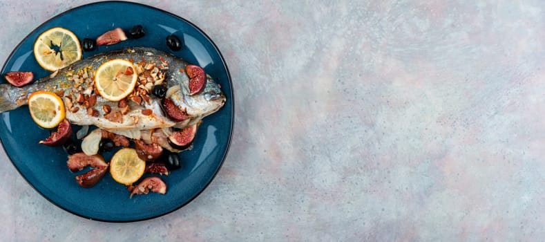 Baked dorado fish with almonds and figs. Autumn recipe. Space for text