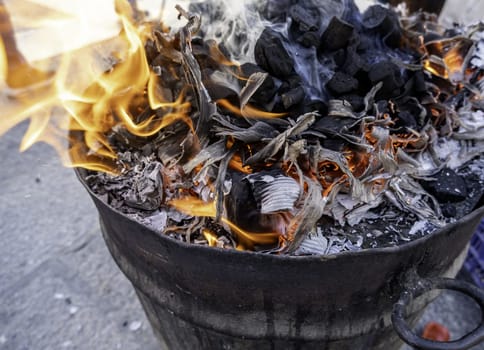 Barbecue preparation with burning charcoal, celebration and outdoor food