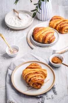 Cinnamon rolls or Franzbroetchen -  Germany sweet pastry sweet pastry baked with butter and cinnamon,  croissant