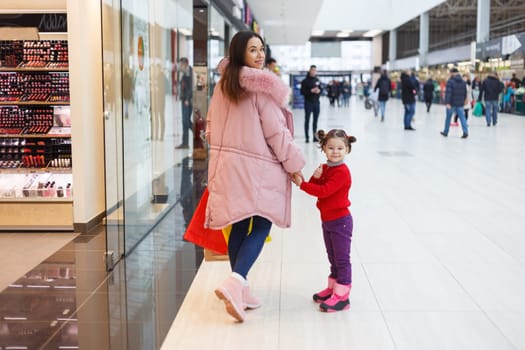 Mom and daughter make purchases together