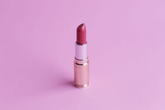 Fashion lipstick on pink background, Essential beauty item