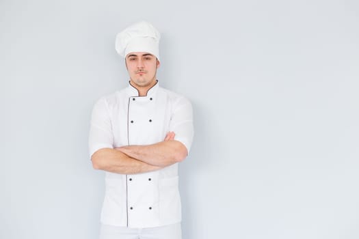 Pleased chef looking confidently at the camera. Professional approach to business.