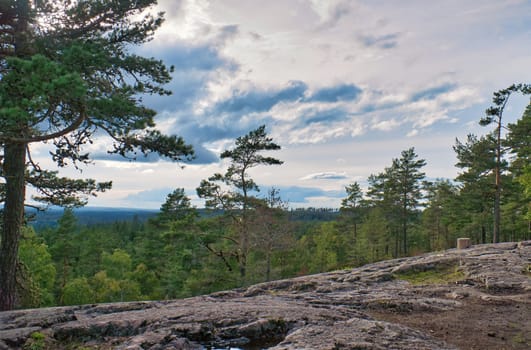 Skurugata in Smaland, Sweden. Viewpoint with view over forests in Scandinavia. Hiking trail over rocks and through forests. Destination
