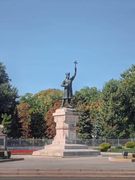 Stephen the Great monument (Stefan cel Mare statue) in front of the central park in a sunny autumn day, Chisinau city, Moldova