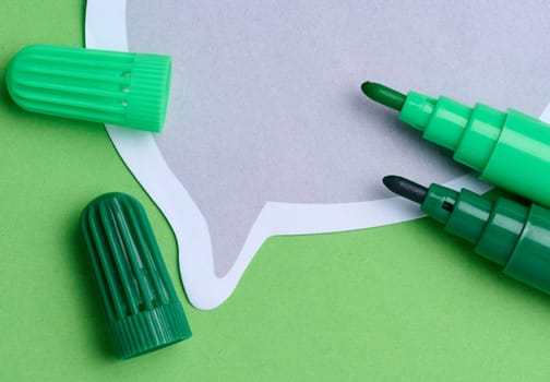 Green and yellow markers on a green background, top view