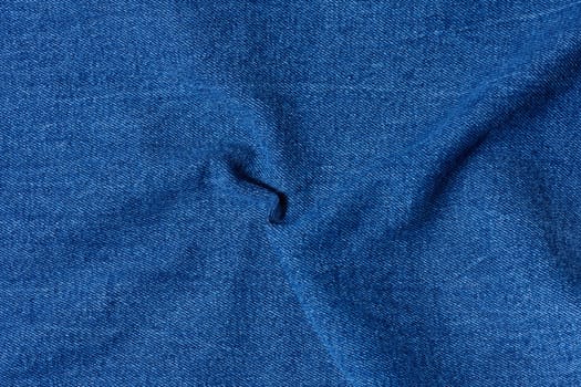 Blue denim, fabric twisted, close up