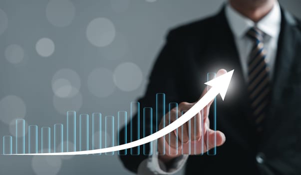 The narrative of development to success and growing growth is defined by business analysis, financial investment, and tech concept. Financial graph on virtual screen illuminates the path.