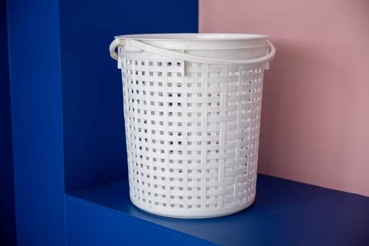Laundromat convenience store. Empty new white plastic laundry clothes basket at convenience store for support customer, Laundry and housework concept