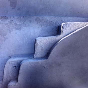 Narrow stone steps, a traditional piece of architecture on the island of Santorini. Greece