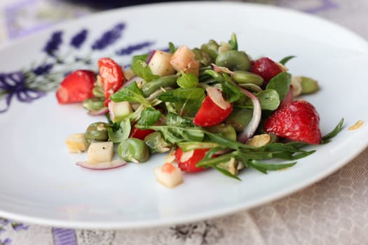 salad with strawberries and broad beans. Delicious dish in a healthy style