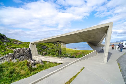 NORDMELA, NORWAY - AUGUST 6, 2023: Bukkekjerka parking place with characteristic public toilet with reflective mirror windows. It is located on Andoya, the northern part of the Lofoten islands.
