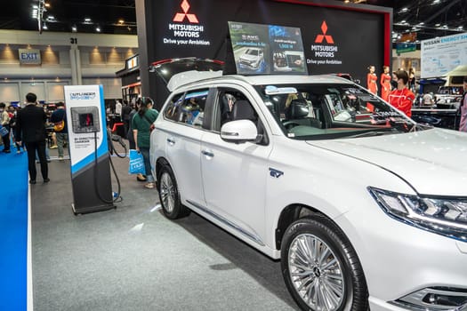 Nonthaburi, Thailand - APR 2, 2023 Electric car and chargers at The 44th Bangkok international motor show 2023 at IMPACT Arena, Muang Thong Thani, Nonthaburi, Thailand.