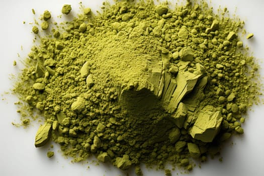 Matcha green tea powder on a light surface.top view .