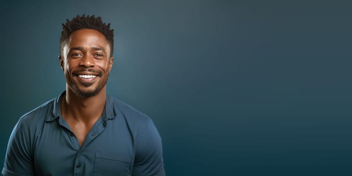 Portrait of a happy young black african man, smiling face, casual dressed, blue background