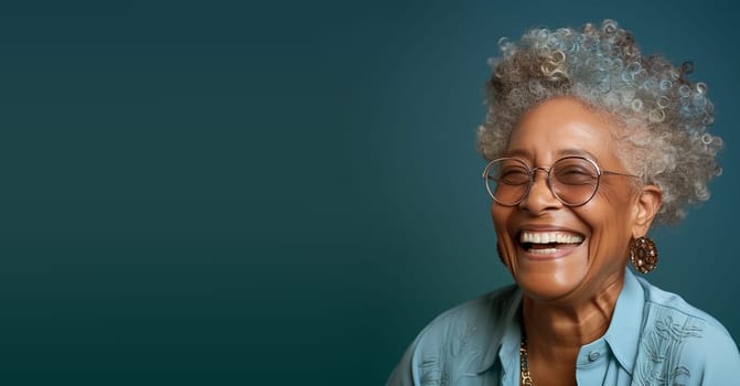 Portrait of a happy old black african woman with eyeglasses, smiling face, pensioner with white hair, blue background
