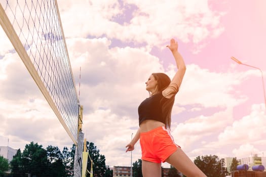 Young, beautiful girl athlete in sportswear is training and running, stretching at the stadium