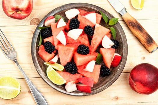 Vitamin salad of watermelon, blackberry and peach. Healthy summer dessert