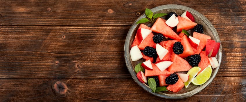 Vitamin salad of watermelon, blackberry and peach. Healthy summer dessert