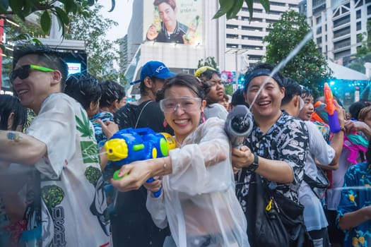 Siam Square, Bangkok, Thailand - APR 14, 2023 Songkran Festival, The short action of people joins celebrations of the Thai New Year or Songkran in Siam Square Bangkok, Thailand.