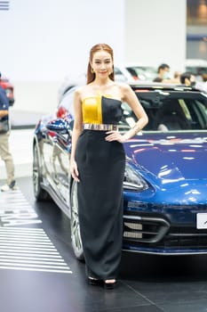 Nonthaburi, Thailand - MAR 26, 2023 Unidentified model poses with a car at The 44th Bangkok international motor show 2023 at IMPACT Arena, Muang Thong Thani, Nonthaburi, Thailand.