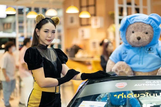 Nonthaburi, Thailand - MAR 26, 2023 Unidentified model poses with a car at The 44th Bangkok international motor show 2023 at IMPACT Arena, Muang Thong Thani, Nonthaburi, Thailand.