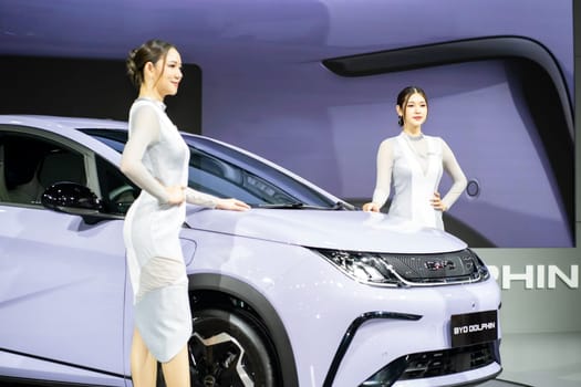 Nonthaburi, Thailand - MAR 26, 2023 Unidentified model poses with a car at The 44th Bangkok international motor show 2023 at IMPACT Arena, Muang Thong Thani, Nonthaburi, Thailand.