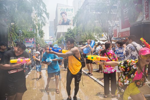 Siam Square, Bangkok, Thailand - APR 13, 2023 Songkran Festival, The short action of people joins celebrations of the Thai New Year or Songkran in Siam Square Bangkok, Thailand.