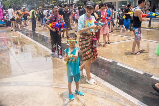 Siam Square, Bangkok, Thailand - APR 13, 2023 Songkran Festival, The short action of people joins celebrations of the Thai New Year or Songkran in Siam Square Bangkok, Thailand.