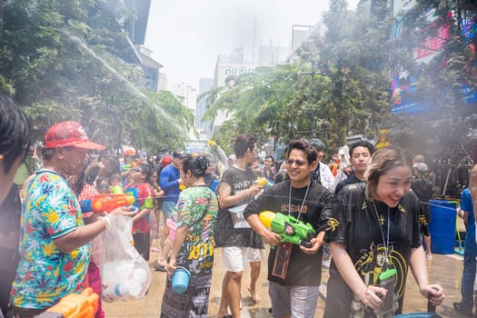 Siam Square, Bangkok, Thailand - APR 13, 2023 Songkran Festival, The short action of people joins celebrations of the Thai New Year or Songkran in Siam Square Bangkok, Thailand.