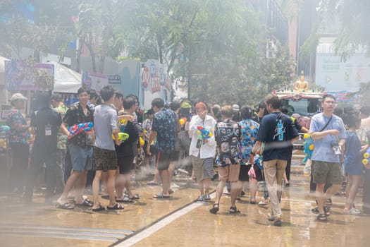 Siam Square, Bangkok, Thailand - APR 13, 2023 Songkran Festival, The short action of people joins celebrations of the Thai New Year or Songkran in Siam Square Bangkok, Thailand.