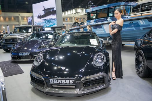 Nonthaburi, Thailand - APR 2, 2023 Unidentified model poses with a car at The 44th Bangkok international motor show 2023 at IMPACT Arena, Muang Thong Thani, Nonthaburi, Thailand.